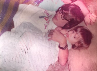 My brother David at about 13 with him arm around me, about one